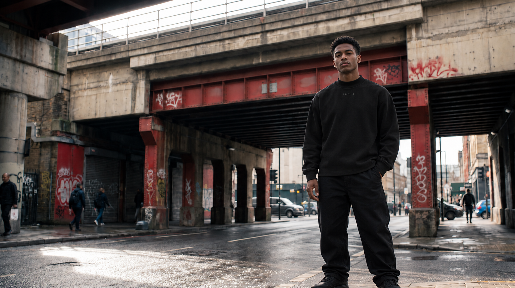 Model wearing the black IONIC Mock Neck on a city street